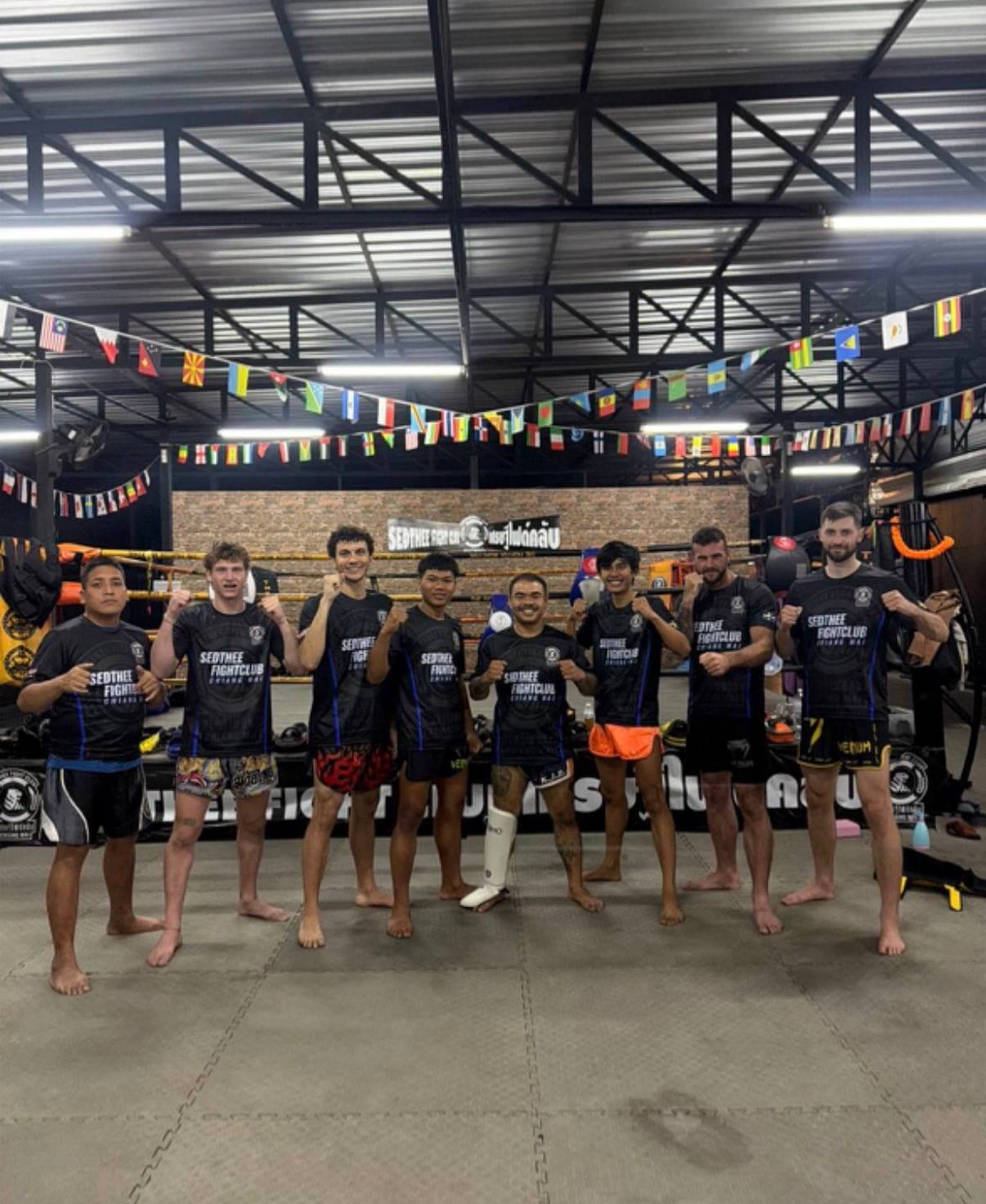 Muay Thai training group on the mats